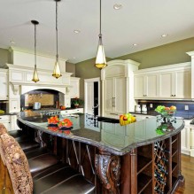 The Kitchen with island dining table with lighting at Scottsdale, AZ 