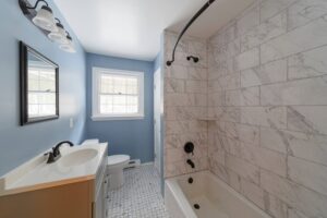 A bathroom with a shower and sink