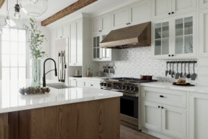 A kitchen with white cabinets and a black faucet